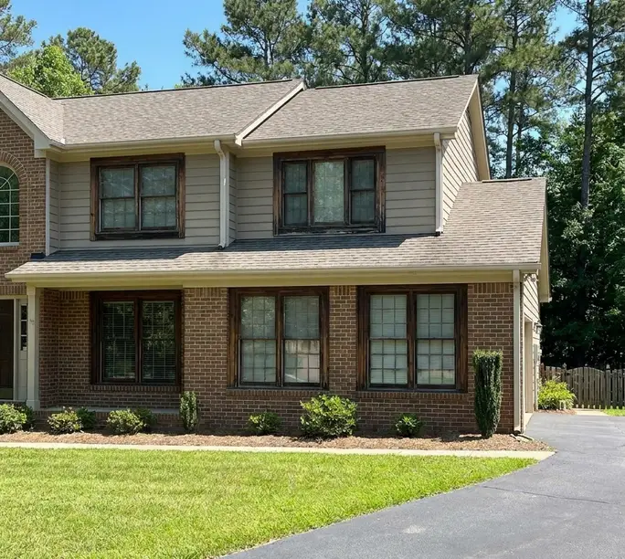 Wood-framed windows sealed and kept rather than replaced in a Kannapolis home