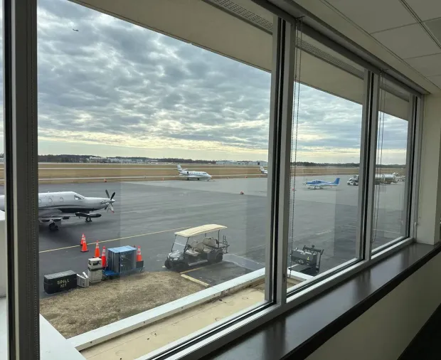 Commercial window wall at a Durham airport terminal serviced by WowFix — big panes, big views