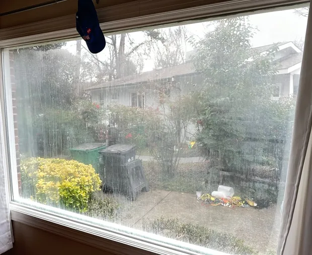 Fogged double-pane glass that no cloth can clean — the haze lives between the panes