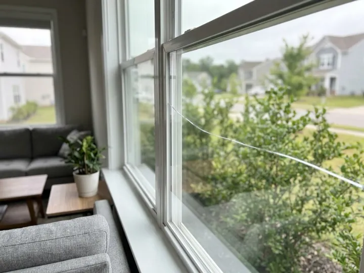 Broken window pane removed before a new pane is cut to size