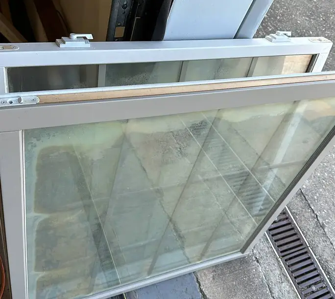 Old fogged unit next to the new WowFix-built insulated glass unit