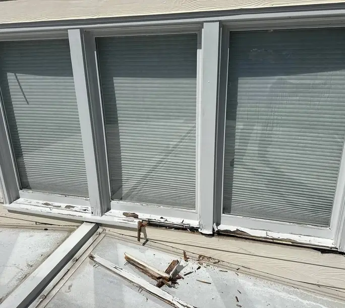Rotted sills across a triple window before the WowFix repair