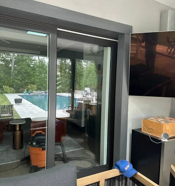 Sliding patio door serviced poolside — WowFix cap on the bench