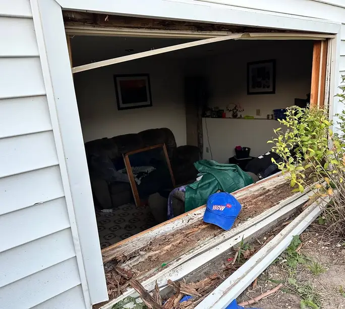 Window opening fully exposed on replacement day — rot handled before the new unit