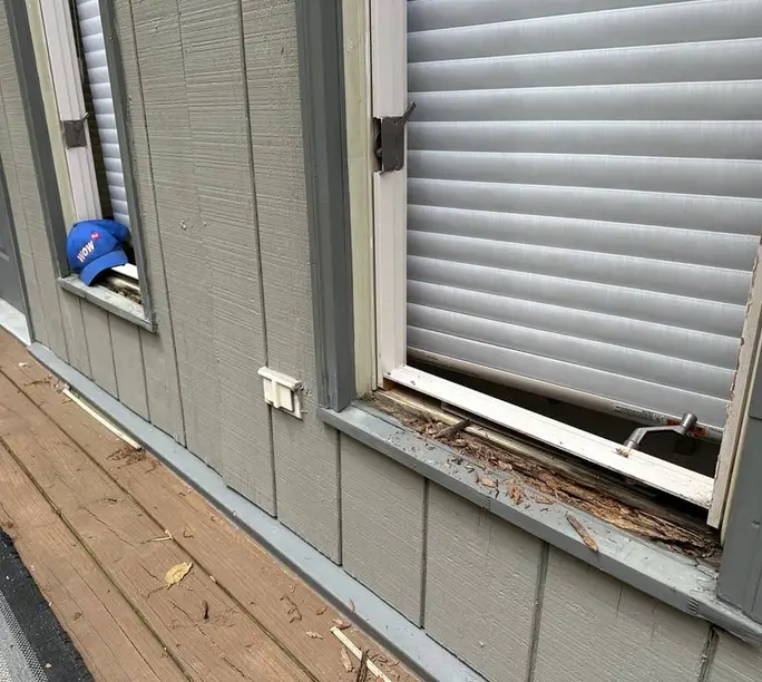 Window sill cut out mid-repair — decay removed to sound wood