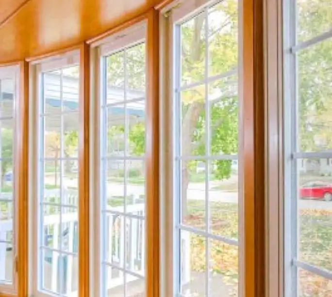 Warm wood-framed bay windows in like-new condition after WowFix work in Charlotte
