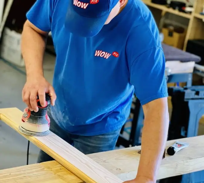 WowFix craftsman at the workshop bench preparing a repair piece