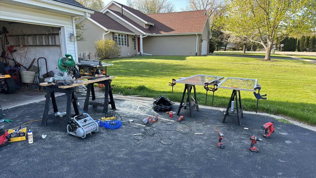 Image showcasing the step-by-step process of repairing a damaged window, with tools and materials laid out for restoration.