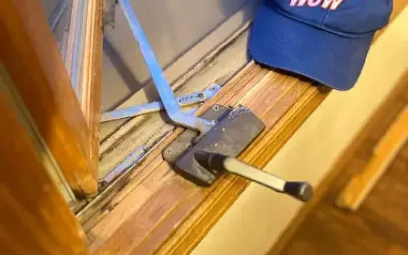 Photo displaying worn-out or broken window hardware, highlighting the need for replacement or repair to restore functionality and ensure proper window operation.