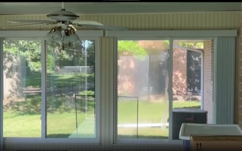 Sunroom with sliding glass doors and screens showing typical wear and tear, demonstrating need for professional screen repair in Charlotte